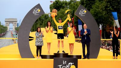 Chris Froome tops the Tour de France podium after winning the general classification. Adam Davy / Press Association