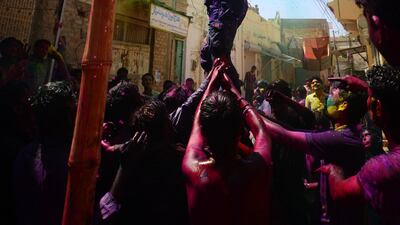 During the Holi festival in Mithi, a man is lifted up so he can break the pitcher filled with yoghurt. The practice is meant to celebrate the birthday of the deity Krishna, who was known to break the pitchers of milkmaids who brought him water instead of milk and honey. According to Ansari, this custom is unique to Hindus in Pakistan. Mobeen Ansari
