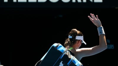 Garbine Muguruza waves goodbye to the Australian Open after being knocked out in the second round. Thomas Peter / Reuters