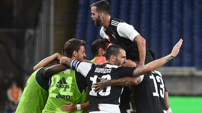 Juventus players celebrate with Cristiano Ronaldo after he scored the second goal. EPA