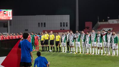 The Palestine and Lebanon players line up before kick-off. Antonie Robertson/The National