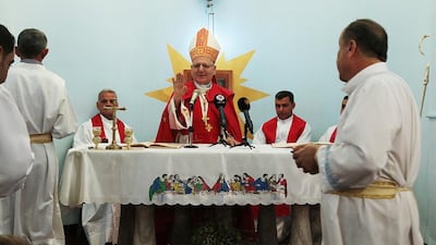 Mar Louis Raphael Sako, the patriach of Chaldean Christians in Iraq, holds Maundy Thursday rites in the church of the village Malabarwan. on April 13, 2017. (Florian Neuhof for The National)