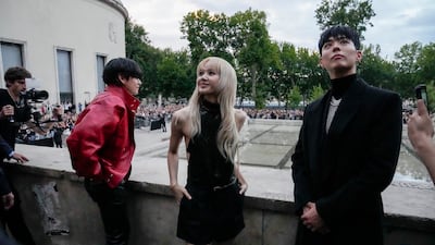 The K-pop stars caused quite a commotion upon their arrival at the Celine show. AP