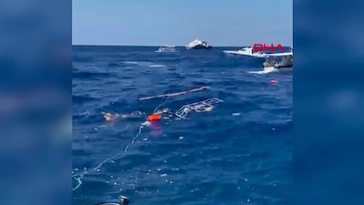 Passengers waiting to be rescued at sea. AFP