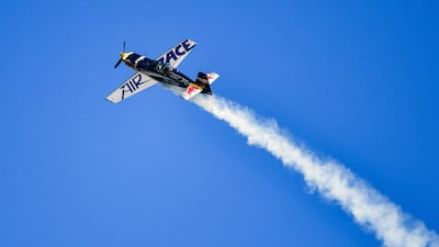 A pilot of the Red Bull Racing Team flies during practice. AFP
