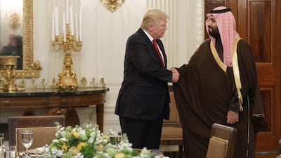In this photo from March 14, 2017, US president Donald Trump shakes hands with Saudi defense minister and Deputy Crown Prince Mohammed bin Salman, in the state dining room of the White House in Washington. Evan Vucci, File / AP Photo