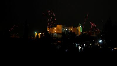 Syrian army soldiers fire tracer bullets into the air to celebrate their victory outside Harasta in eastern Ghouta, in Damascus, Syria on March 23, 2018. Omar Sanadiki / Reuters