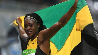 Jamaica’s Elaine Thompson celebrates after winning the women’s 200m final at the 2016 Rio Olympics on Wednesday. (AFP)