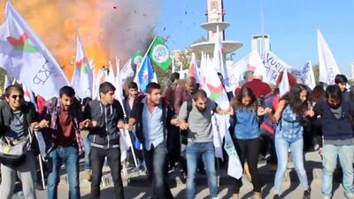 The first of two explosions rips through leftist and pro-Kurdish protesters staging an anti-government peace rally in Ankara on October 10, 2015, killing at least 95 people. Dokuz 8 / AFP