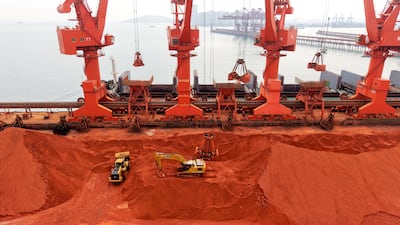 A cargo ship loads imported iron ore at the ore terminal of Qingdao Port, Shandong Province, China. Getty Images