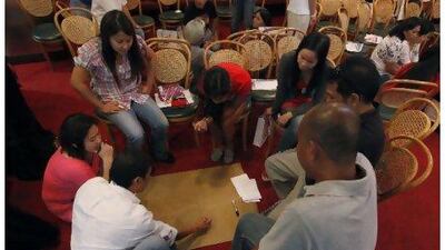 Participants at the paralegal training workshop discuss common problems encountered by Filipino workers.