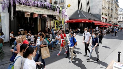 Customers sit outdoors at the Maison Sauvage and Atlas in Paris after France allowed restaurants and cafes to reopen from June 2 2020. Reuters