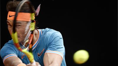 Nadal Spain returns a backhand to Djokovic. AFP