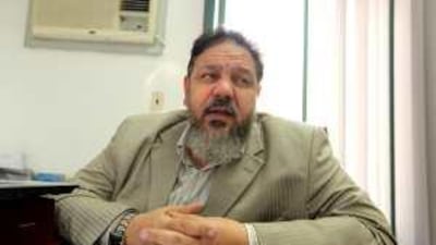 The lawyer for those accused of planning terrorist attacks in Egypt, Montasser al Zayat, talks in his office in Cairo.