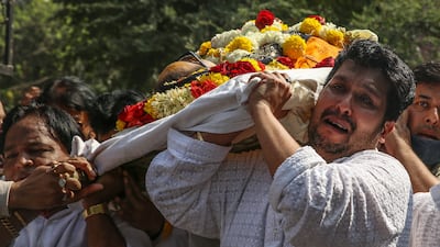 Bappi Lahiri's son Bappa Lahiri carries the mortal remains of his father. EPA