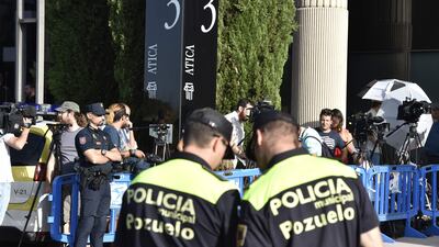 Police and media stand waiting for the arrival of Real Madrid's Portuguese forward Cristiano Ronaldo to appear at a court in Pozuelo de Alarcon. Gerard Julien / AFP