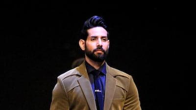 An Indian model showcases a creation by designer Manish Malhotra during Lakme Fashion Week (LFW) Winter/Festive 2015 in Mumbai. AFP PHOTO / Sujit Jaiswal