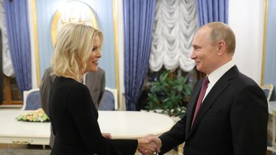 Russia's President Vladimir Putin shakes hands with US NBC news network anchor Megyn Kelly prior to an interview at the Kremlin. Michael Klimentyev/ Sputnik/ AFP Photo