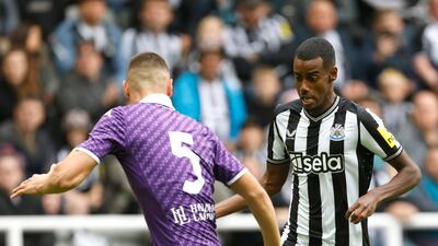 Newcastle United's Alexander Isak and Fiorentina's Nikola Milenkovic battle. PA