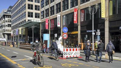 People cycle on Friedrichstrasse shopping street in Berlin, Germany, which has been turned into a bicycle street free of cars. Getty Images