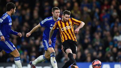 Meanwhile at Stamford Bridge in London, Mark Yeates of Bradford City scores his team's fourth goal during the FA Cup fourth-round match against Chelsea. Mike Hewitt / Getty Images