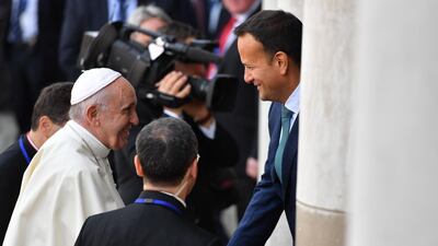Pope Francis is greeted by Mr Varadkar on his arrival at Dublin Castle. AFP