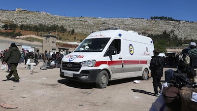 Syrian civilians and rebel fighters evacuated from Eastern Ghouta arrive in the village of Qalaat al-Madiq, some 45 kilometres northwest of the central city of Hama, on March 26, 2018, as evacuations from Eastern Ghouta continued following a deal that was announced earlier in the week. Abdulmonam Eassa / AFP