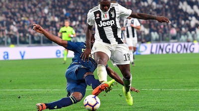 Juventus' Moise Kean, right, and Udinese's Ben Wilmot in action. ANSA via AP