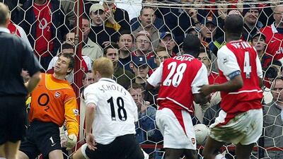 Manchester United midfielder Paul Scholes, centre, grabs the winner against Arsenal in the FA Cup semi-final on April 3, 2004. Odd Andersen / AFP
