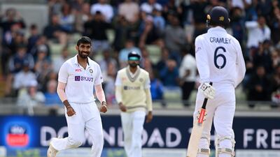 India bowler Jasprit Bumrah smiles at Zak Crawley after bowling the England opener. Getty