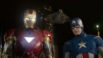 Robert Downey Jr as Iron Man, left, and Chris Evans as Captain America, in a scene from The Avengers. AP Photo