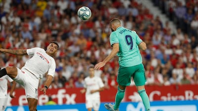 Real Madrid's Karim Benzema, right, scores his side's opening goal. AP Photo
