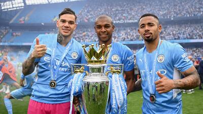 Ederson, Fernandinho and Gabriel Jesus pose with the Premier League trophy. Getty