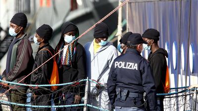 Migrants disembark a rescue vessel at Bari harbour in Italy. EPA
