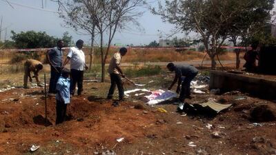 Indian authorities inspect the site of a suspected meteorite landing in Vellore, Tamil Nadu on February 7. A bus driver died from the incident. AFP Photo