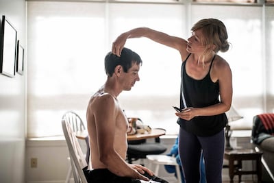 Alex Honnold gets his haircut by his girlfriend Sanni McCandless before attempting his free solo of El Cap. National Geographic.