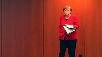 German Chancellor Angela Merkel waits for the beginning of a press conference in Berlin, Germany, on May 6, 2020 after an online meeting with German state governors on the loosening of the restictions to reduce the spread of the new coronavirus. AFP