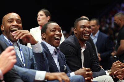 Former NBA players Vince Carter, Isiah Thomas and Chris Bosh before the match. Reuters