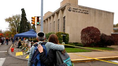 People pay their respects at a makeshift memorial outside the Tree of Life Synagogue in November 2018. AP