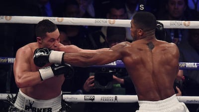 Anthony Joshua (R) of Great Britain exchanges blows with Joseph Parker (L) of New Zealand in the 12th and final round of their heavyweight unification title bout at Principality Stadium in Cardiff, March 31, 2018. (AFP)