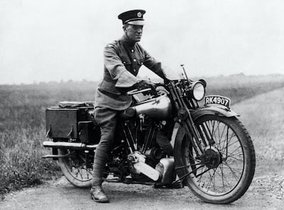 T.E. Lawrence in the seat of a Brough Superior SS100. Brough bike were customised to cater for his diminutive stature. PA