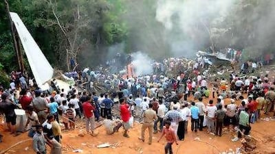 The scene shortly after Flight IX 812 overshot the runway and crashed at Mangalore airport on May 22.
