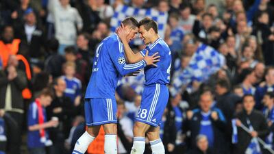 Chelsea striker Fernando Torres, left, celebrates scoring the opening goal with Chelsea defender Cesar Azpilicueta during their Champions League loss to Atletico Madrid on Wednesday. Glyn Kirk / AFP / April 30, 2014