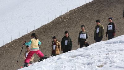 A young competitor makes her way down the slope as she competes in the women's race. Rick Findler for The National