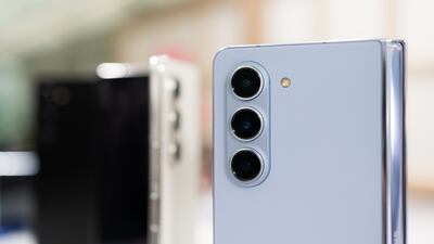 A triple camera module on the rear of a Galaxy Z Fold 5