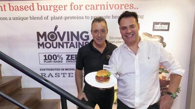 Anthony Rastelli and Simeon Van Der Molen, right, with their Moving Mountains plant-based burger at Gulfood. Antonie Robertson / The National