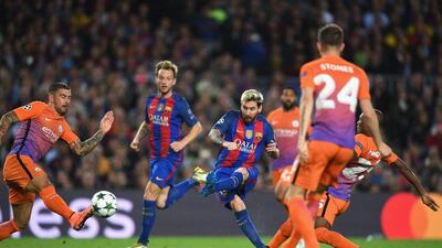Lionel Messi of Barcelona scores his team’s second goal. Shaun Botterill / Getty Images