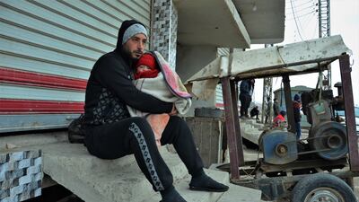 A Syrian displaced man due to the security operations against the Islamic State (IS) group carries his child as he waits for the approval from Kurdish security forces to return to his house at a district in Hasaka, northeastern of Syria. The US-backed Syria Democratic Forces (SDF) announced that they had retaken full control of Ghwayran prison in the city of Hasaka and re-arrested dozens of jihadists holed up in the prison and in nearby houses, after a major jailbreak attempt from the so-called Islamic State group (IS or ISIS) militants. EPA