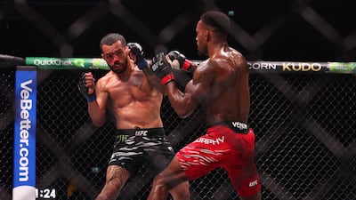 Lerone Murphy battles with Dan Ige, left, in their featherweight bout