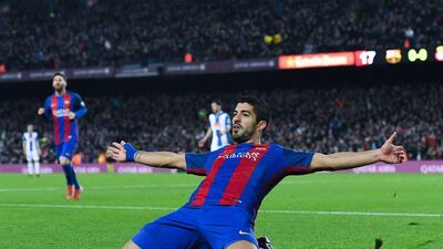 Luis Suarez slides on his knees after scoring Barcelona’s opening goal. David Ramos / Getty Images